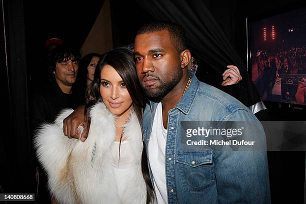Kim Kardashian and Kanye West attend the Kanye West Ready-To-Wear Fall/Winter 2012 show as part of Paris Fashion Week at Halle Freyssinet on March 6,...