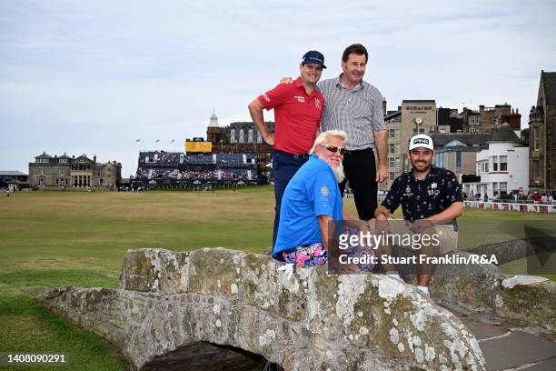 John Daly of the United States, Zach Johnson of the United States, Sir Nick Faldo of England and Louis Oosthuizen of South Africa pose on the Swilcan...