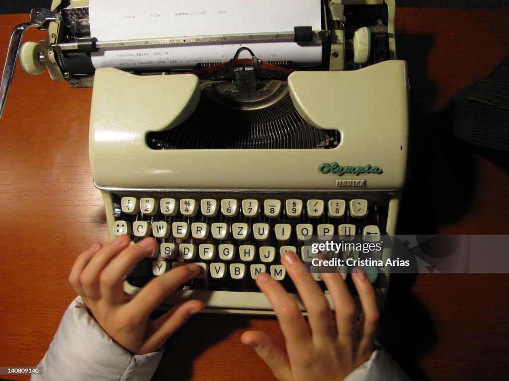 Typing in an old typewriter.