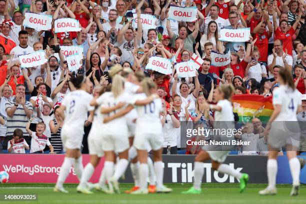 England fans celebrate after their sides third goal during the UEFA Women's Euro 2022 group A match between England and Norway at Brighton & Hove...