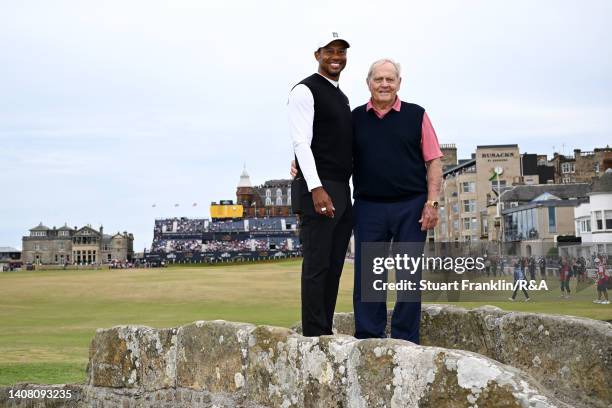 Tiger Woods of the United States and Jack Nicklaus of the United States pose on the Swilcan Bridge on the 18th hole during the Celebration of...