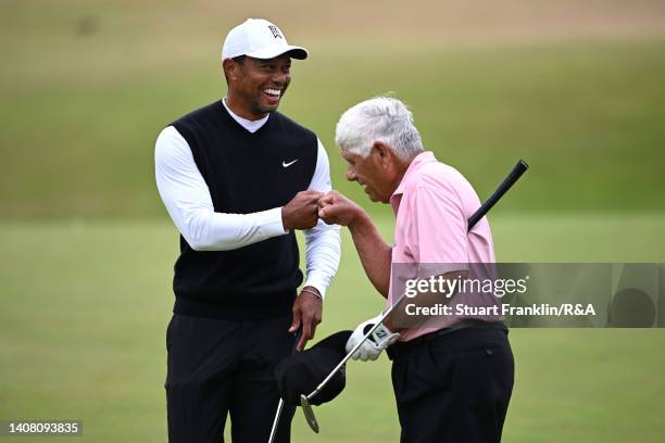 Tiger Woods of the United States and Lee Trevino of the United States bump fists during the Celebration of Champions prior to The 150th Open at St...