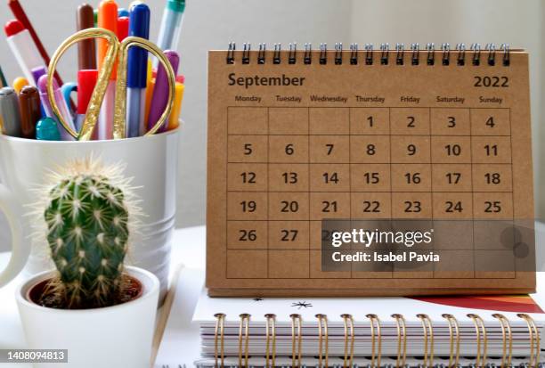 september calendar on desk - september stock pictures, royalty-free photos & images