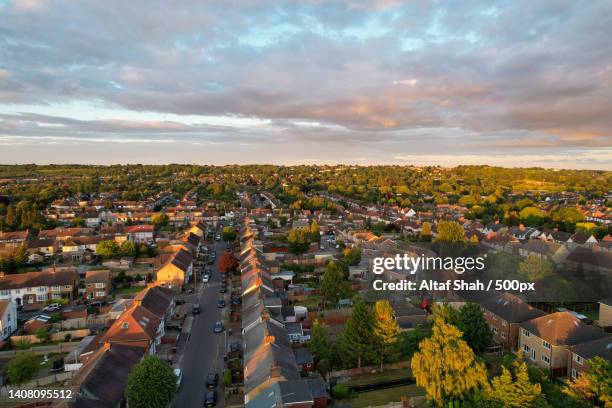 best aerial cityscape view of england at golden hour sunset time with colourful clouds on sky,luton,united kingdom,uk - house golden hour stock pictures, royalty-free photos & images