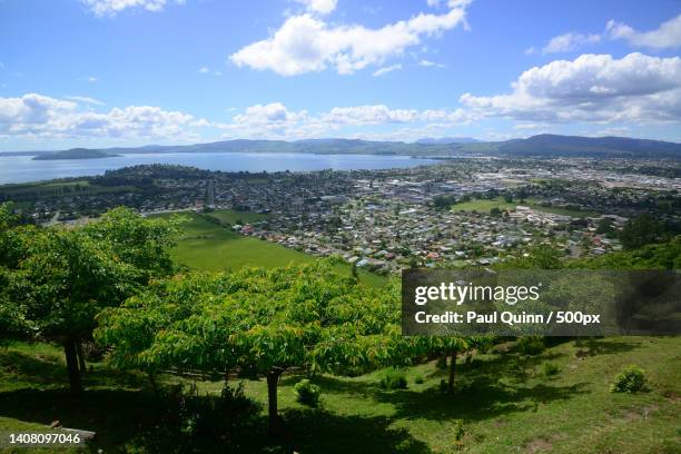 scenic view of landscape against sky,rotorua,new zealand - rotorua stock pictures, royalty-free photos & images