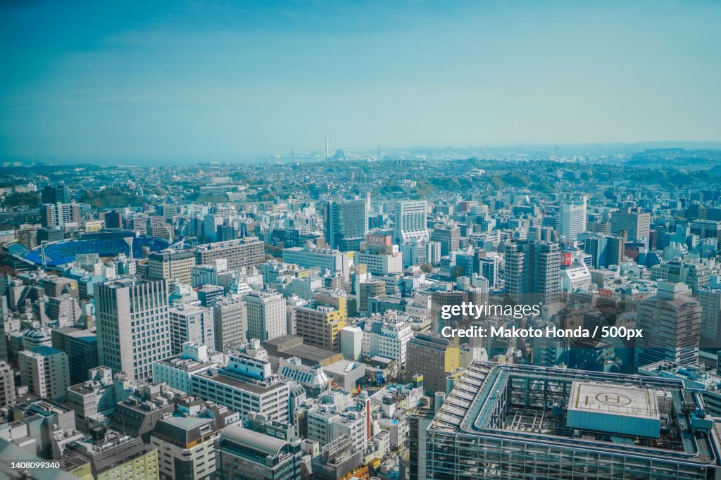 High angle view of modern buildings in city against sky
