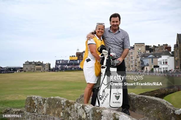 Sir Nick Faldo of England and caddie Fanny Sunesson pose on the swilcan bridge during the Celebration of Champions prior to The 150th Open at St...