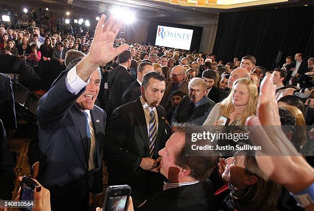 Republican presidential candidate, former Massachusetts Gov. Mitt Romney greets supporters at a Super Tuesday night gathering with his family on...