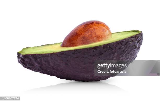 ripe avocado cut in half - cut in half ストックフォトと画像