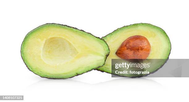 ripe avocado cut in half - bisected 個照片及圖片檔