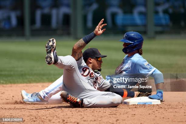 Bobby Witt Jr. #7 of the Kansas City Royals slides safely into second base for a seal as Javier Baez of the Detroit Tigers is late with the tag...