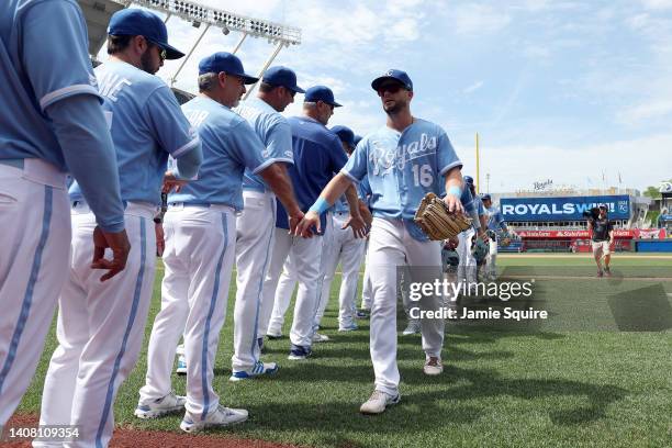 Andrew Benintendi of the Kansas City Royals congratulates teammates after the Royals defeated the Detroit Tigers 3-1 to win game one of a...