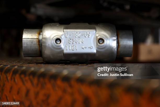 Brand new catalytic converter sits on a car lift at Johnny Franklin's Muffler on July 11, 2022 in San Rafael, California. Thefts of catalytic...