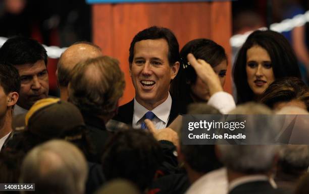 Republican presidential candidate, former U.S. Sen. Rick Santorum greets people during a primary night party at the Steubenville High School...