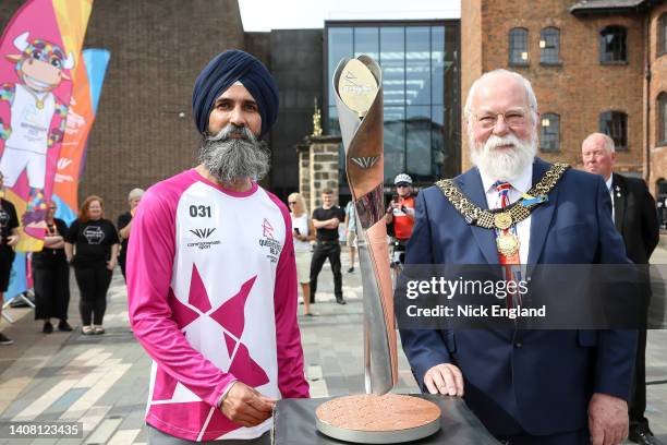 Batonbearer Kuldip Rangi and Mayor of Derby councillor Robin Wood, with the Queen's Baton during the Birmingham 2022 Queen's Baton Relay visit to...