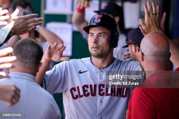 Luke Maile of the Cleveland Guardians celebrates after scoring against the Kansas City Royals in the first inning at Kauffman Stadium on July 9, 2022...