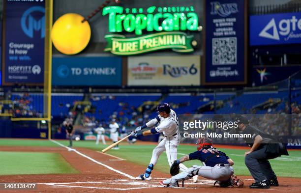Josh Lowe of the Tampa Bay Rays hits an RBI single in the first inning during a game against the Boston Red Sox at Tropicana Field on July 11, 2022...