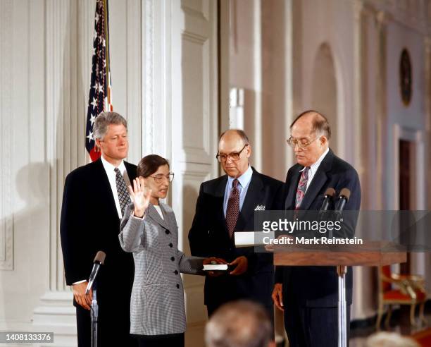 Ruth Bader Ginsburg is Sworn in as Associate Justice of the Supreme Court of the United States. President William Clinton stands behind her as her...