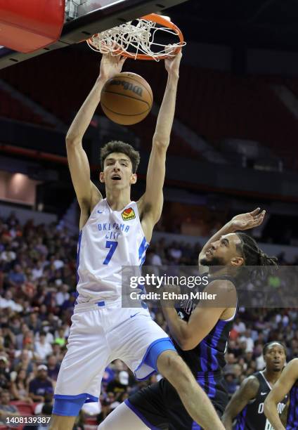 Chet Holmgren of the Oklahoma City Thunder dunks against Devin Cannady of the Orlando Magic during the 2022 NBA Summer League at the Thomas & Mack...