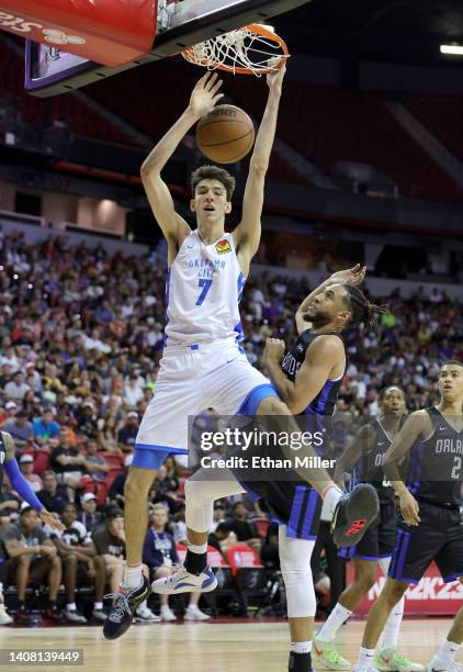 Chet Holmgren of the Oklahoma City Thunder dunks against Devin Cannady of the Orlando Magic during the 2022 NBA Summer League at the Thomas & Mack...