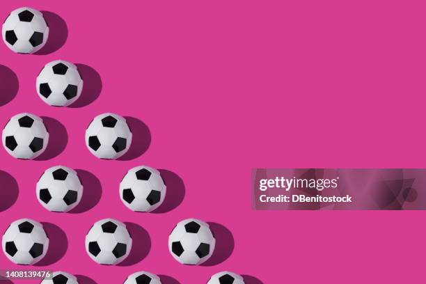 retro soccer balls pattern with hard shadow, on the left side, on pink background. concept of soccer, sport, competition and world champion. - copa do mundo imagens e fotografias de stock