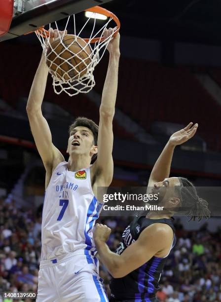 Chet Holmgren of the Oklahoma City Thunder dunks against Devin Cannady of the Orlando Magic during the 2022 NBA Summer League at the Thomas & Mack...