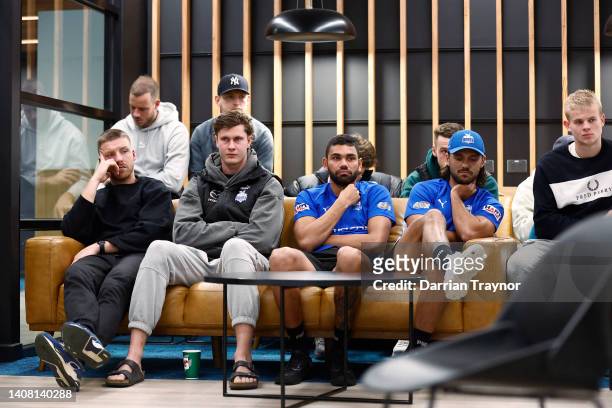 Players look on during a North Melbourne Kangaroos AFL press conference at Arden Street Ground on July 12, 2022 in Melbourne, Australia.