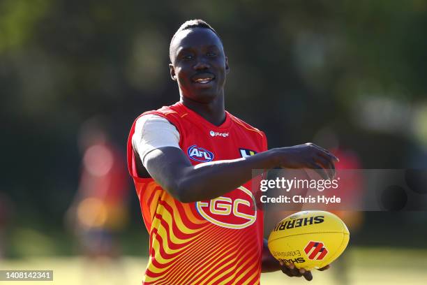 Mabior Chol during a Gold Coast Suns AFL training session at Metricon Stadium on July 12, 2022 in Gold Coast, Australia.