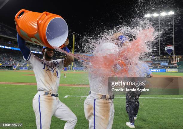 Bobby Witt Jr. #7 of the Kansas City Royals is doused by MJ Melendez after the Royals defeated the Detroit Tigers 6-3 to win game two of a...
