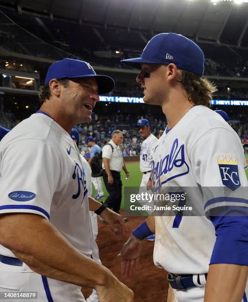 Manager Mike Matheny of the Kansas City Royals congratulates Bobby Witt Jr. #7 after the Royals defeated the Detroit Tigers 6-3 to win game two of a...