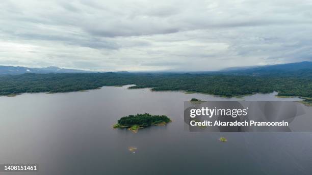 drone aerial view of a lake reservoir of a dam with reflection on the water - itaipu dam stock pictures, royalty-free photos & images