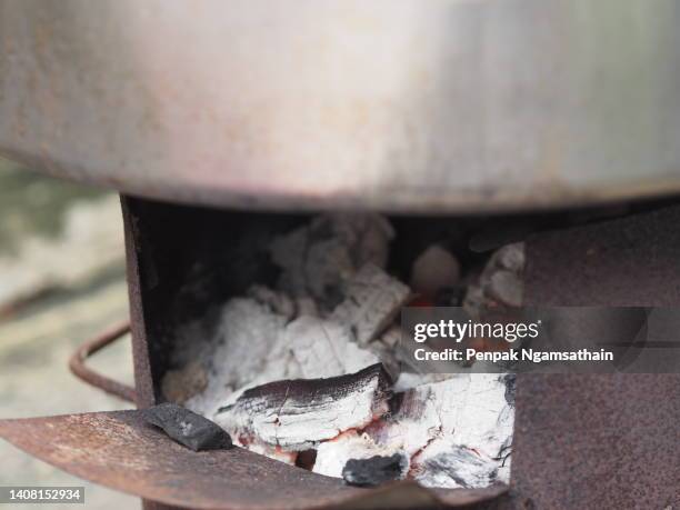 charcoal stove fire is burning - wood burning stove stock-fotos und bilder