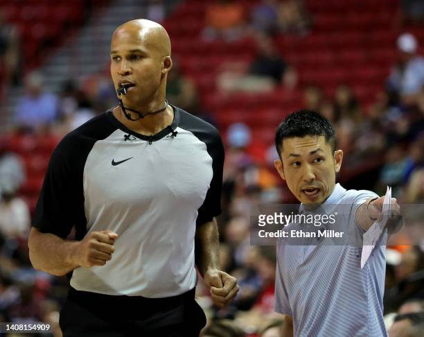 Sports analyst and former NBA player Richard Jefferson runs by head coach Dice Yoshimoto of the New York Knicks as Jefferson officiates the second...