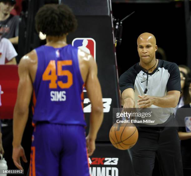 Sports analyst and former NBA player Richard Jefferson gives the ball to Jericho Sims of the New York Knicks for a free throw attempt as Jefferson...