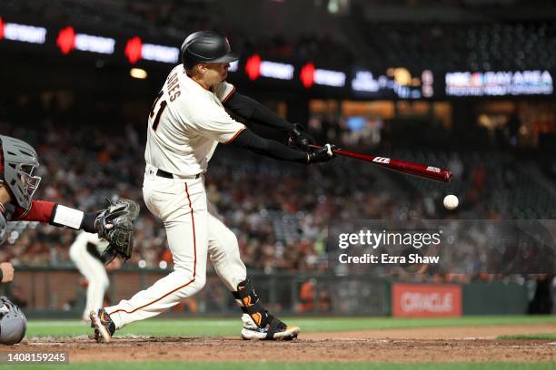 Wilmer Flores of the San Francisco Giants hits a double that scored a run in the eighth inning against the Arizona Diamondbacks at Oracle Park on...