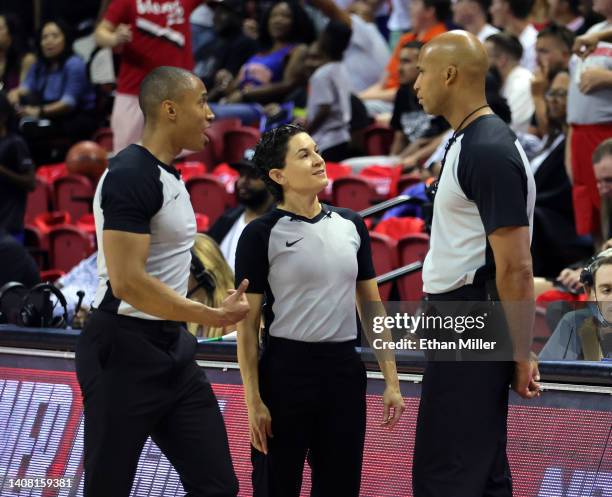 Referees Robert Hussy and Cheryl Flores and ESPN sports analyst and former NBA player Richard Jefferson talk on the court as Jefferson gets ready to...