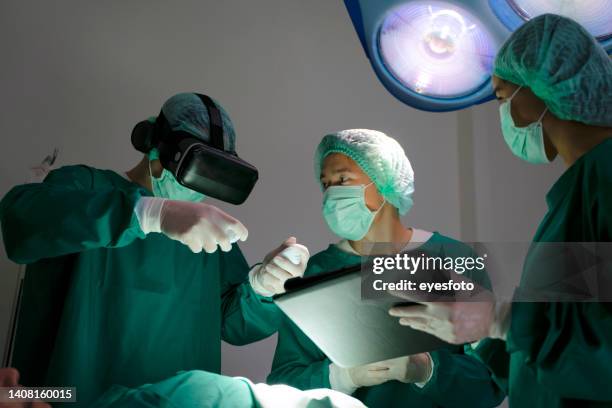 doctors are surgery to patient at operating room. - exame médico procedimento médico imagens e fotografias de stock