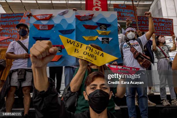 Filipinos take part in a protest against Chinese maritime activities in the disputed South China Sea, outside the Chinese Embassy on July 12, 2022 in...