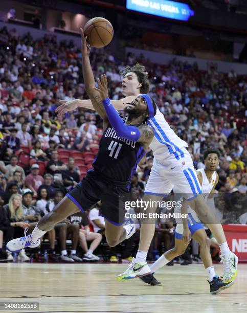 Zavier Simpson of the Orlando Magic shoots against Josh Giddey of the Oklahoma City Thunder during the 2022 NBA Summer League at the Thomas & Mack...