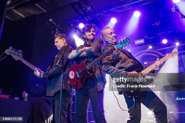 Fran Smith Jr., Eric Bazilian and John Lilley of the American band The Hooters perform live on stage during a concert at the Columbia Theater on July...