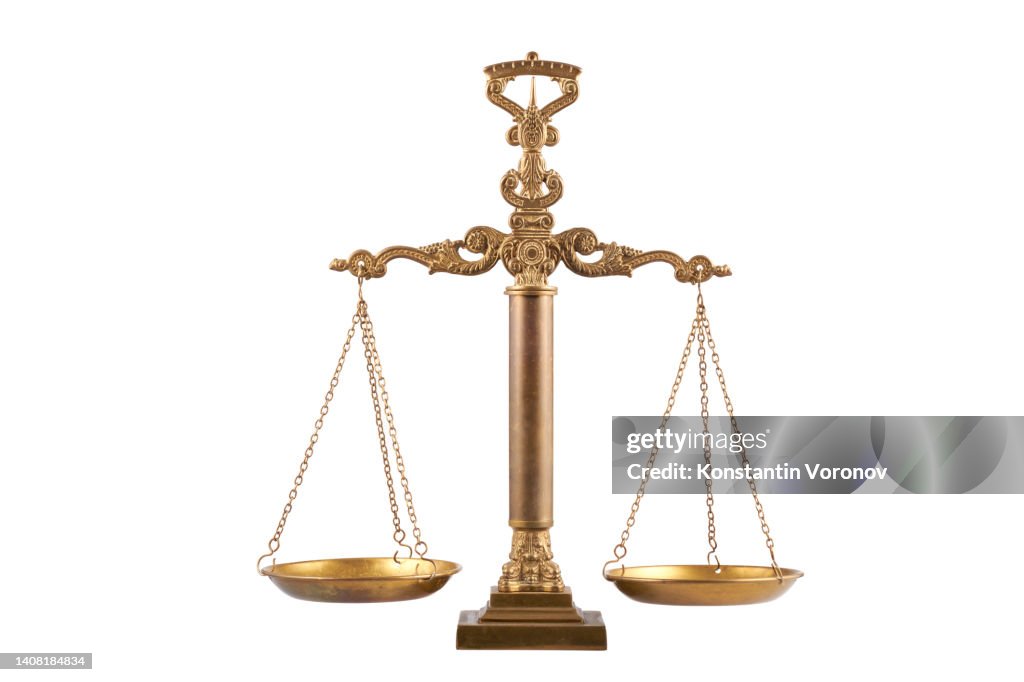 Ornate vintage balanced scales isolated on white background. Balance concept of law and justice.