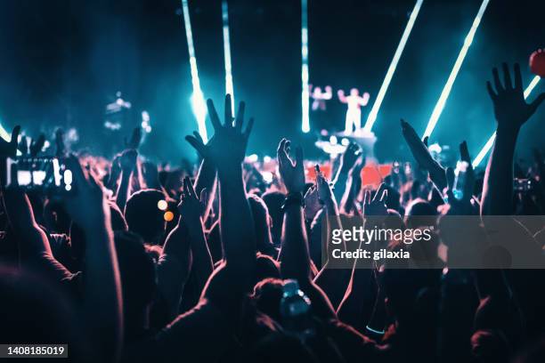 rave party silhouettes. - touring music festival stock pictures, royalty-free photos & images