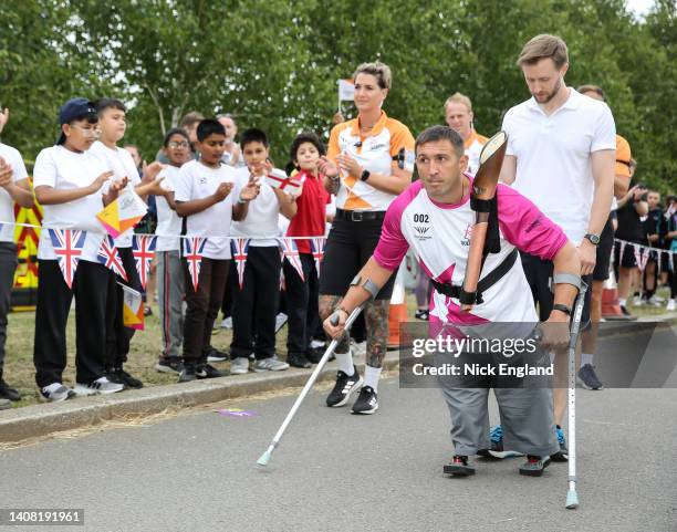 Baton bearer Ben Parkinson holds the Queen's Baton during the Birmingham 2022 Queen's Baton Relay on a visit to Sheffield Olympic Legacy Park on July...