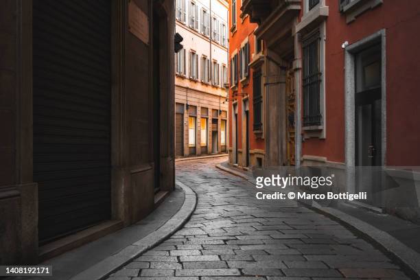 old street in milan, italy - alley stock-fotos und bilder
