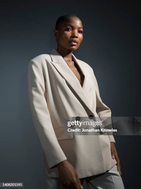 portrait confident young woman in white blazer - purple blazer stock pictures, royalty-free photos & images