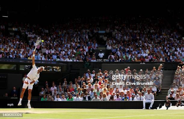 Novak Djokovic of Serbia serves against Nick Kyrgios of Australia during their Men's Singles Final match on day fourteen of The Championships...