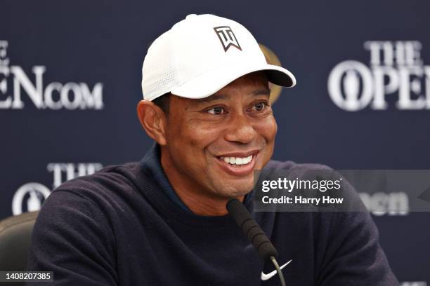 Tiger Woods of The United States looks on as they are interviewed during a practice round prior to The 150th Open at St Andrews Old Course on July...