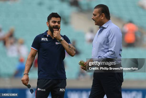 Virat Kohli of India talks with Ravi Shastri before the first Royal London ODI between England and India at The Kia Oval on July 12, 2022 in London,...