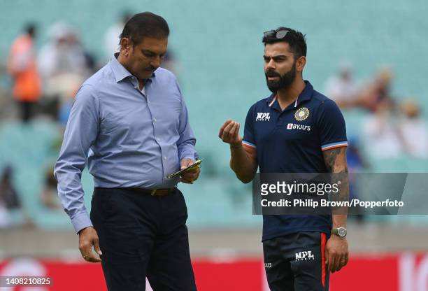 Virat Kohli of India talks with Ravi Shastri before the first Royal London ODI between England and India at The Kia Oval on July 12, 2022 in London,...