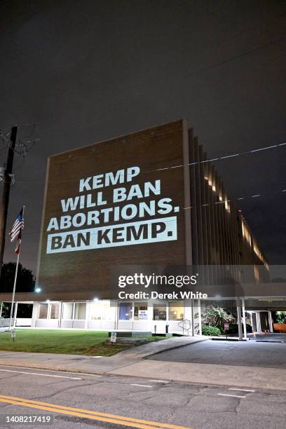 Abortion rights activists put a spotlight on candidates Herschel Walker and Brian Kemp's anti-abortion stances at the Georgia Republican Party Office...